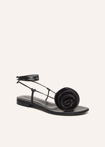 SS23 WRAP AROUND FLAT FLOWER SANDALS SATIN BLACK